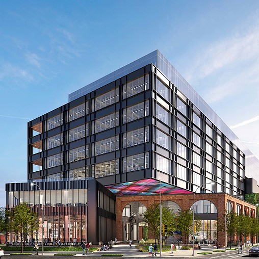 A large building with a parking lot.