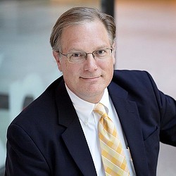 A man in a suit and tie.