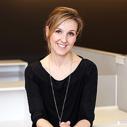 A woman smiling for the camera.