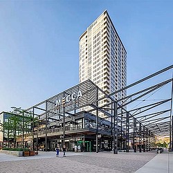 A tall building with a glass front.