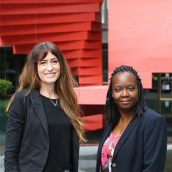 A couple of women smiling.