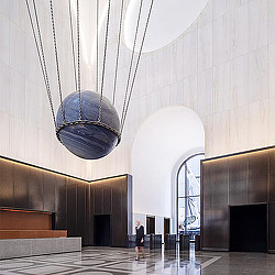 A person standing in a large room.