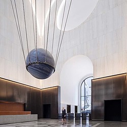 A person walking in a large building.