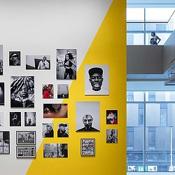 A yellow post with pictures on it.