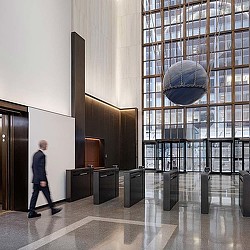 A person walking in a large room.