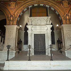 A large ornate building with statues.