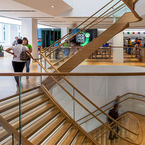A person taking a picture of a staircase.