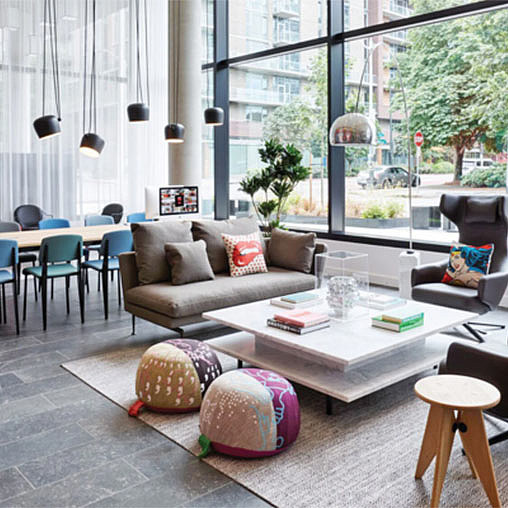 A living room with a couch and chairs.