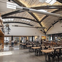 A large room with tables and chairs.