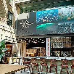 A restaurant with tables and chairs.