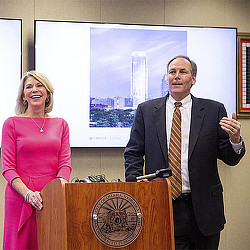 A man and a woman standing at a podium.