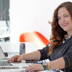 A woman working on her laptop.