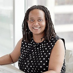 A woman smiling for the camera.