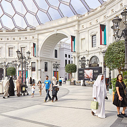 People walking in a large building.