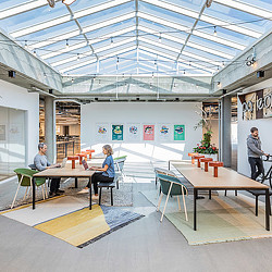 A few people sitting at tables.