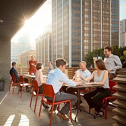 A group of people sitting at a table in a restaurant.