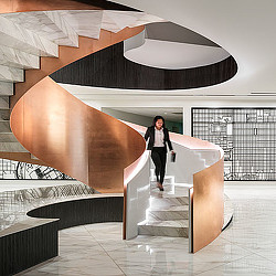 A person standing on a staircase.