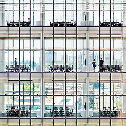 A group of people standing in a building.