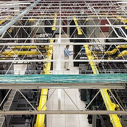 A person standing in a factory.
