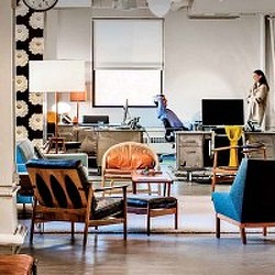 A room with a table and chairs.