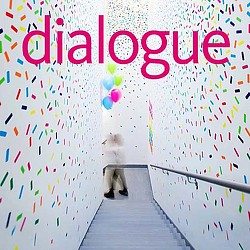 A dog sitting on a staircase.