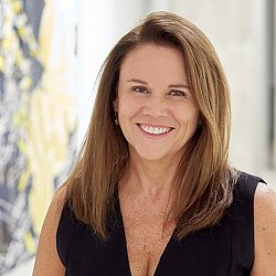 A woman smiling at the camera.