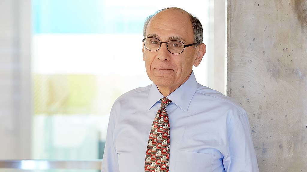 A man wearing glasses and a tie.