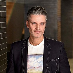 A man in a leather jacket.