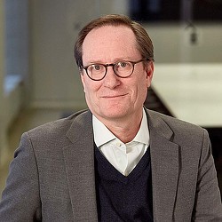 A man wearing glasses.