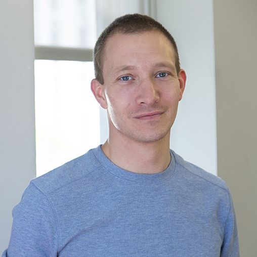 A man in a blue shirt.