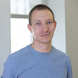 A man in a blue shirt.