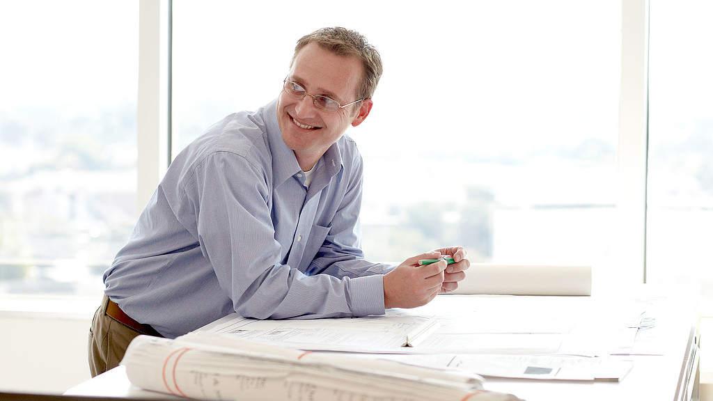 A man sitting at a desk.