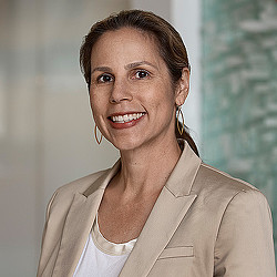 A close-up of a person smiling.