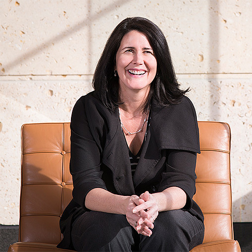 A woman sitting in a chair.