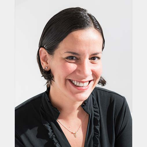 A woman smiling for the camera.