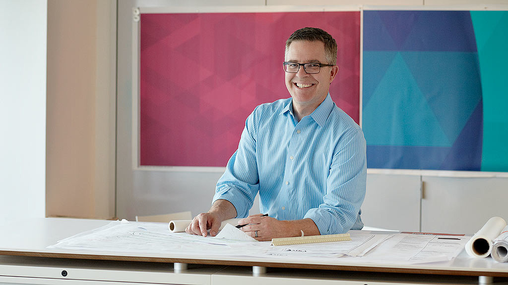 A man sitting at a desk.