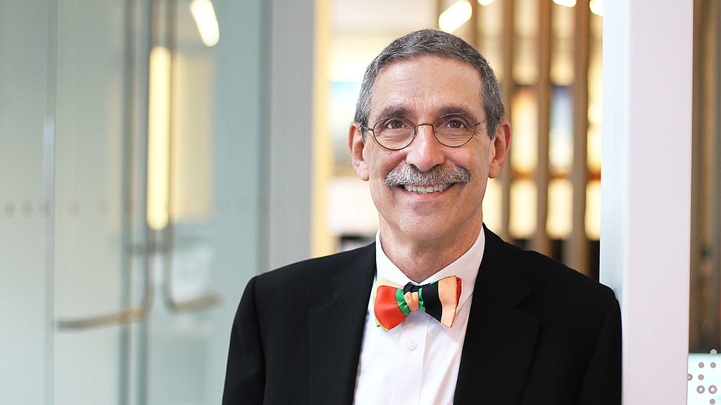 A man wearing a suit and bow tie.