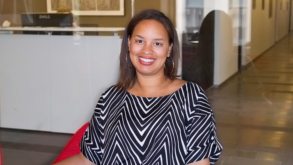 A woman smiling at the camera.