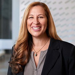 A woman smiling for the camera.