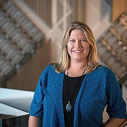 A person smiling for the camera.