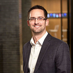 A man wearing glasses.