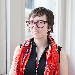 A woman wearing glasses.
