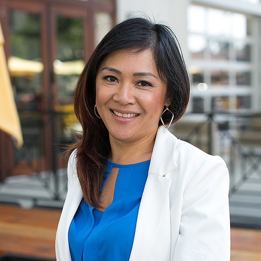 A woman smiling for the camera.