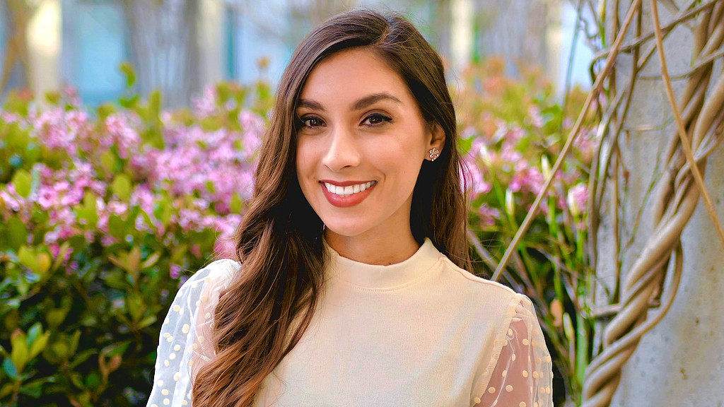 A woman smiling for the camera.