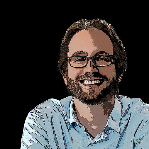 A man with a beard and glasses.