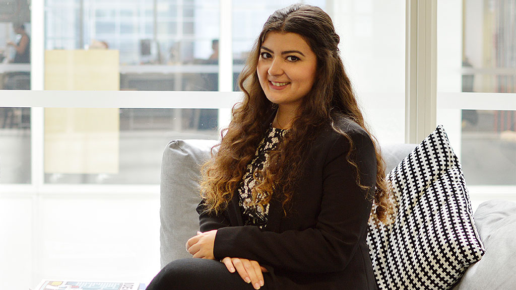 A woman sitting on a couch.