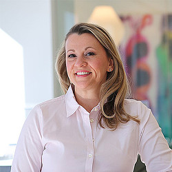 A woman smiling for the camera.