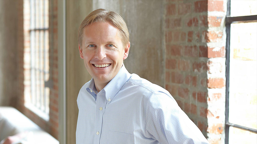 A man smiling for the camera.