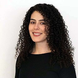 A woman with curly hair.