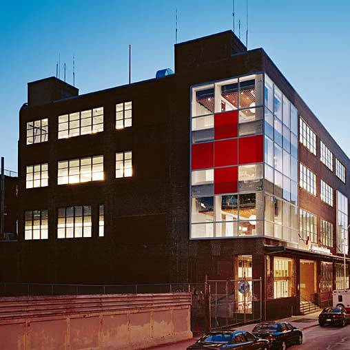 A building with a red and white stripe.